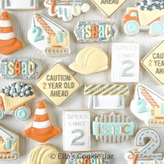 decorated cookies are arranged in the shape of construction signs