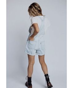 The Levi Vintage Shortalls are a timeless classic, season after season. They have a vintage-inspired look, but feature modern stretch-infused denim for comfort and give. Color: light denim Shell: 79% cotton/21% lyocell Vintage-inspired denim shortalls Adjustable straps Front pouch packet with a four pocket style Machine wash cold, line dry Fits true to size Model is 5’4" wearing an XS Measurements: XS: (0-4) Waist = 31" | Hips = 37" | Rise = 12" | Inseam = 4.8" S: (6-8) Waist = 35" | Hips = 39" Womens Overall Shorts, Levi Overalls, Light Wash Overalls, Overalls Women Shorts, Overalls Cute, Denim Two Piece, Levis Overalls, Clad And Cloth, Womens Denim Overalls