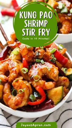 two bowls filled with shrimp stir fry and chopsticks on top of the bowl