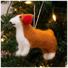 a dog ornament hanging from a christmas tree