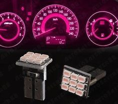 the dashboard lights and gauges are glowing pink