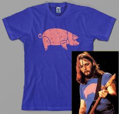 a blue shirt with an image of a pig on it and a photo of a man holding a guitar