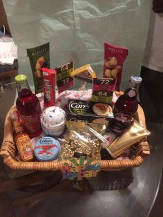 a basket filled with snacks and condiments on top of a table