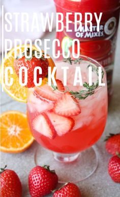 a close up of a drink in a glass with strawberries