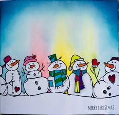 a group of snowmen standing next to each other in front of a colorful background