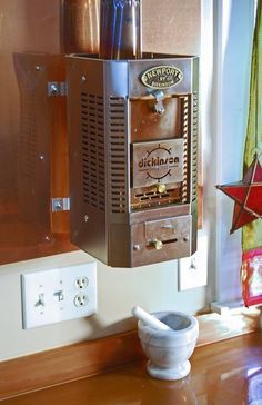 an old fashioned machine sitting on top of a counter next to a star shaped object