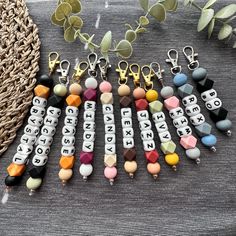 several key chains with words and letters on them