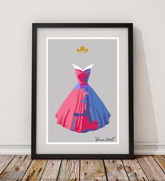 an art print of a dress with a crown on the top, in front of a wooden floor