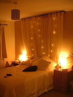 a bed room with a neatly made bed and two lamps on either side of the bed