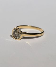 A Salt & Pepper Cognac diamond in a high bezel setting revealing the side profile of the ring. Specifications: Approx 1ct (1.18ct) round double cut salt and pepper diamond, in a high bezel setting, in 14k yellow Custom sized in approx. 10-14 days. Please contact us about rush orders. Everyday Classic Brilliant Cut Diamond Ring, Formal Diamond Ring With Rose Cut Round Stone, Luxury Everyday Ring With Bezel Setting, Formal Rose Cut Diamond Ring With Round Stone, Timeless Round Single Diamond Wedding Ring, Formal Rose Cut Diamond Ring, Classic Moissanite Ring With Bezel Setting, Rings With Single Cut Diamonds, Classic 14k Gold Wedding Ring With Bezel Setting