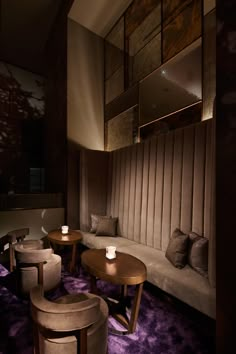 a living room filled with lots of furniture and purple carpeted flooring on top of it