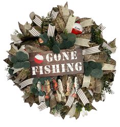 a wreath that says gone fishing is surrounded by ribbons and other things to decorate it