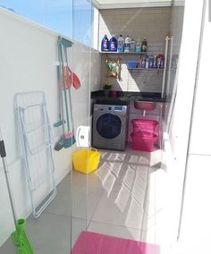 a laundry room with a washing machine and other items