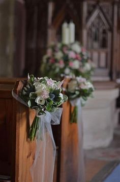 flowers are placed on the pews at a church