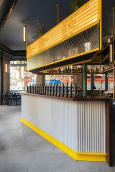 an empty bar with yellow and white bars