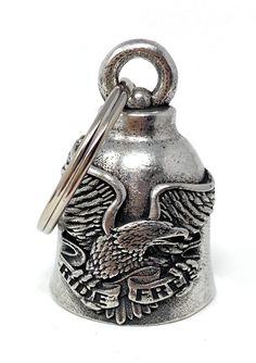 an old style silver bell with eagle emblem on it