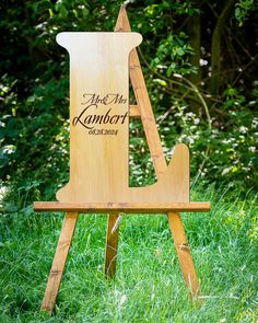 a wooden easel sitting in the grass