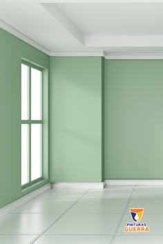 an empty room with green walls and white floors