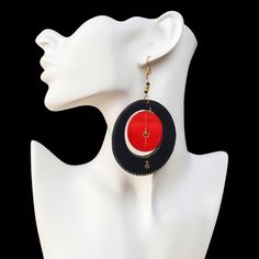 Elegance in Black: Timeless Appeal Embrace the allure of sophistication with these exquisite Black Earrings. Meticulously handcrafted and designed for timeless appeal, these earrings are a perfect blend of style and versatility. The jet-black hue exudes charm, making them a must-have accessory for any occasion. Elevate your look effortlessly with this chic and understated accessory. Passion in Red: Make a Statement Experience the vibrancy of passion with these stunning Red Earrings. The small round red part at the center creates a bold statement, capturing attention with its unique design. Perfect for those who dare to be different, these earrings infuse energy and charisma into your ensemble. Unleash your inner boldness and let your style speak volumes. Nature's Touch: Wooden Earrings Cra Black Enamel Drop Earrings For Party, Black Dangle Hoop Earrings For Party, Black Oval Jewelry For Party, Modern Black Hoop Earrings As Gift, Modern Black Hoop Earrings For Gift, Modern Black Earrings For Party, Black Teardrop Earrings With Black Beads, Black Single Plug Earring For Party, Traditional Black Earrings For Formal Occasions