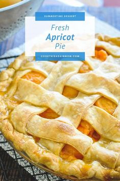 a fresh apricot pie sitting on top of a cooling rack