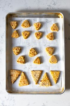 several pieces of food are arranged on a baking sheet, ready to be baked in the oven