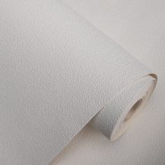 a roll of white paper sitting on top of a table