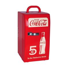 an old fashioned coca - cola machine with the number five on it's side