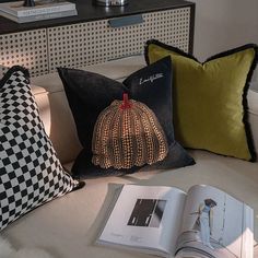 the pillows on the bed are decorated with decorative pumpkins