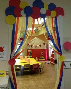 an open door to a room decorated with balloons and streamers