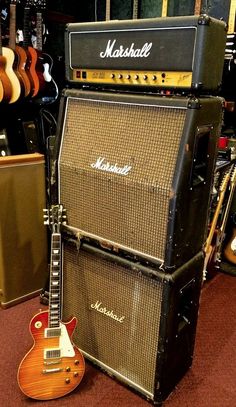 guitars and amps are on display in a music store