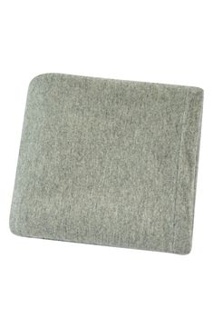 a close up of a gray blanket on a white background