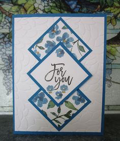 a card with blue flowers and the words for you