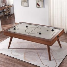 an air hockey table in a living room