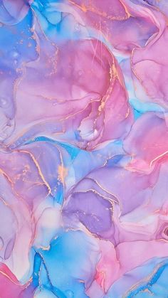 an abstract painting with pink, blue and purple colors on it's surface is shown