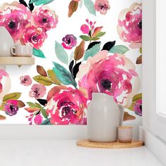 the wallpaper in this kitchen is painted with watercolors and has pink flowers on it