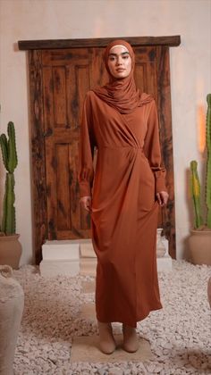 Unleash your inner fashion diva with our collection of maxi dresses. From bold prints to flowy silhouettes, find the perfect dress to make a statement. Brown Maxi Skirt Outfit, Orange Satin Skirt, Elegant Abayas, Brown Maxi Dresses, Modest Summer Outfits, Orange Satin, Swimsuits Outfits, Wrap Maxi Dress, Modest Clothing