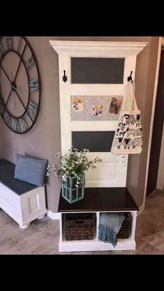 the entryway is decorated with blue and white accents, including a bench that has baskets on it