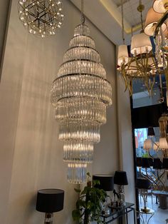 a chandelier hanging from the ceiling in a room