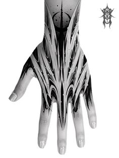 a hand with black and white designs on it