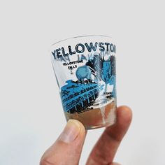 This is a vintage shot glass from Yellowstone National Park in the United States. It is illustrated with blue and black images of sights around the park, such as the geyser named Old Faithful. Vintage Yellowstone, Old Faithful, Family Holidays, Yellowstone National, Yellowstone National Park, Family Holiday, Blue And Black