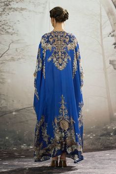 Blue silk long kaftan with all over regal floral prints and patch work waist belt. - Aza Fashions Blue Kaftan For Eid And Traditional Ceremonies, Blue Long Thobe For Wedding, Blue Kaftan For Traditional Ceremonies, Blue Traditional Drape Kaftan For Wedding, Blue Maxi Length Kaftan With Dabka, Blue Long Sleeve Kaftan For Traditional Ceremonies, Blue Long Abaya For Festive Occasions, Blue Bohemian Abaya For Wedding, Blue Bohemian Thobe For Wedding