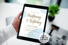 a person holding up a tablet with a birthday card on it