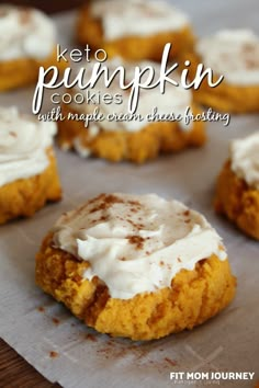 keto pumpkin cookies with maple cream cheese frosting on a piece of parchment paper