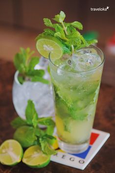 a mojito cocktail with lime and mint garnish