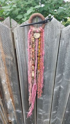 This boho style hair ring can be worn with dreads, but would also be suitable for thick hair. It is made using all natural materials, including a wooden ring, recycled sari silks, merino wool, recycled cotton, banana yarn, wooden beads and zinc alloy charms. It also contains a moose antler button.  The diameters of the ring are 6 cm (inside diameter) and 8.5 cm (outside diameter). The total length including the ring is 75 cm. I am not responsible for any custom fees or taxes. Dreads Diy, Dreadlocks Diy, Dye Wig, Yarn Dreads, Boho Style Hair, Wind Hair, Boho Hair Wrap, Pink Goddess, Witch Bells