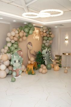 balloon decorations and balloons in the shape of animals are on display at a birthday party