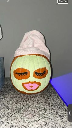 a pumpkin with a face painted on it