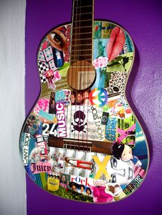 a guitar with many stickers on it