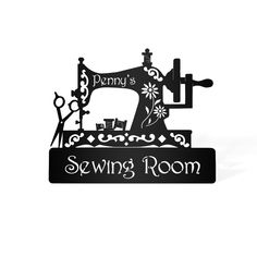 the sewing room sign is made out of black paper and has an image of a sewing machine on it