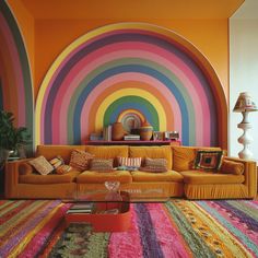 a living room with a rainbow colored wall and colorful rugs on the floor in front of it